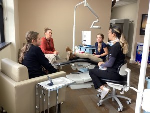 The doctor consulting with patients inside consultation room