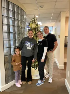 Dr. Jeff Twohig posing with patients