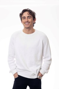 image of a young, smiling male adult with braces