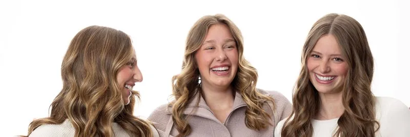 3 adult women laughing