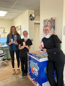 Staff posing inside with ice cream