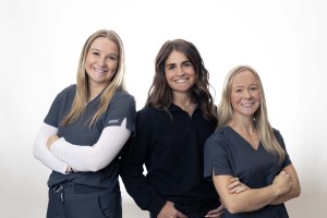 Three women staff posing