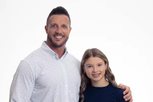 Father and daughter smiling/posing